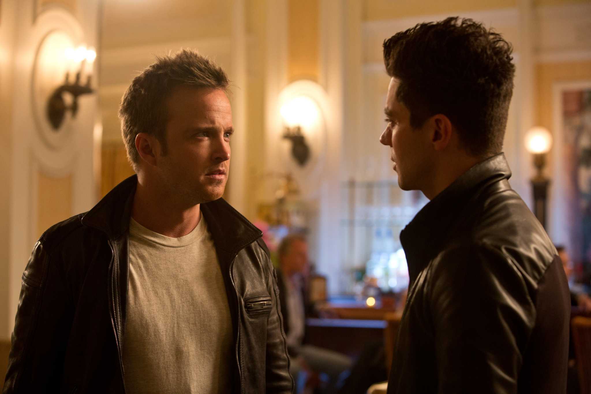 Tobey Marshall (Aaron Paul, center) with Benny (Scott Mescudi, left) and  Joe Peck (Ramon Rodriguez) are featured in this scene in DreamWorks  Pictures' Need for Speed, an exciting return to the great