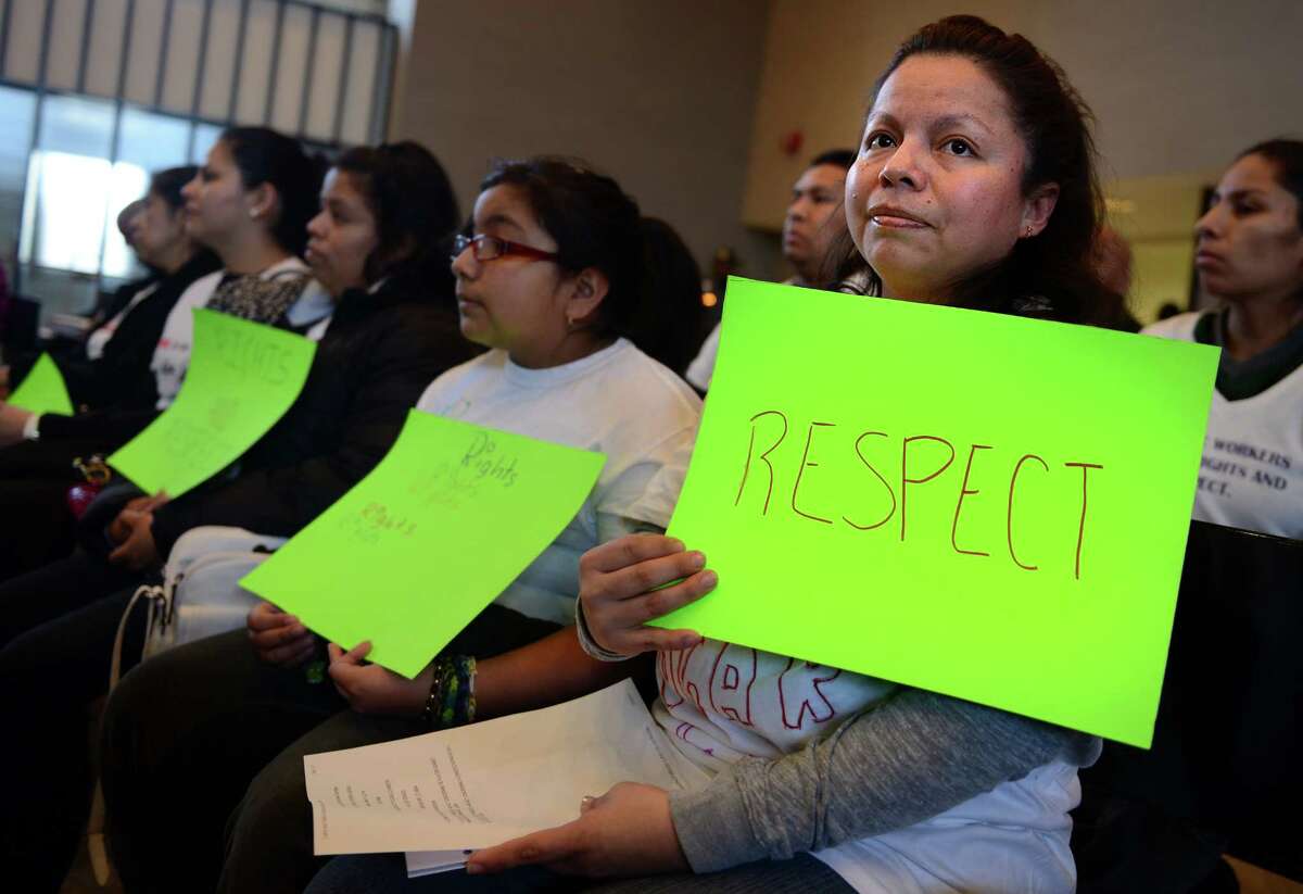 Mariana Reyes, of Bridgeport, attends a public hearing Thursday, Mar. 13, 2014, in support of the proposed Connecticut Domestic Workers' Bill of Rights at City Hall in Bridgeport, Conn.