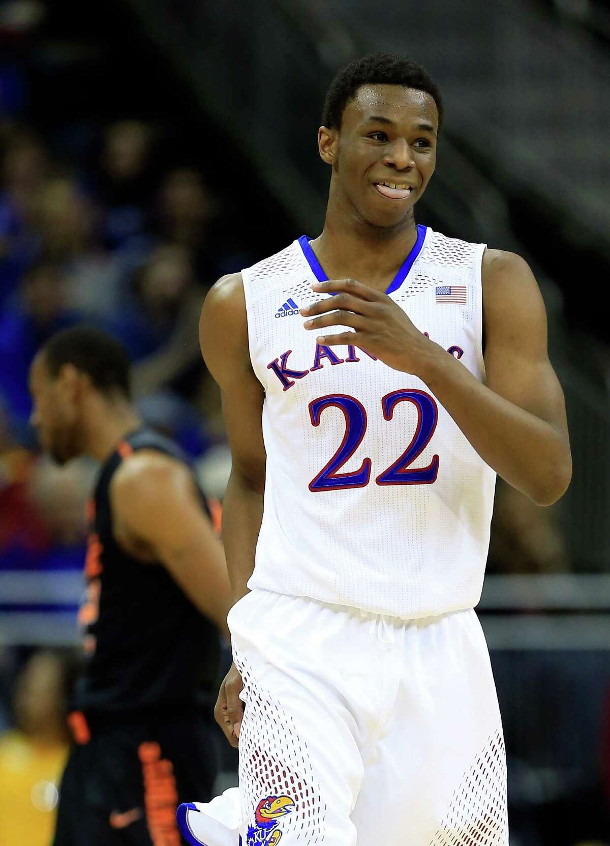 KANSAS CITY, MO - MARCH 13: Andrew Wiggins #22 of the Kansas Jayhawks reacts after making a three-pointer during the Big 12 Basketball Tournament quarterfinal game against the Oklahoma State Cowboys at Sprint Center on March 13, 2014 in Kansas City, Missouri.