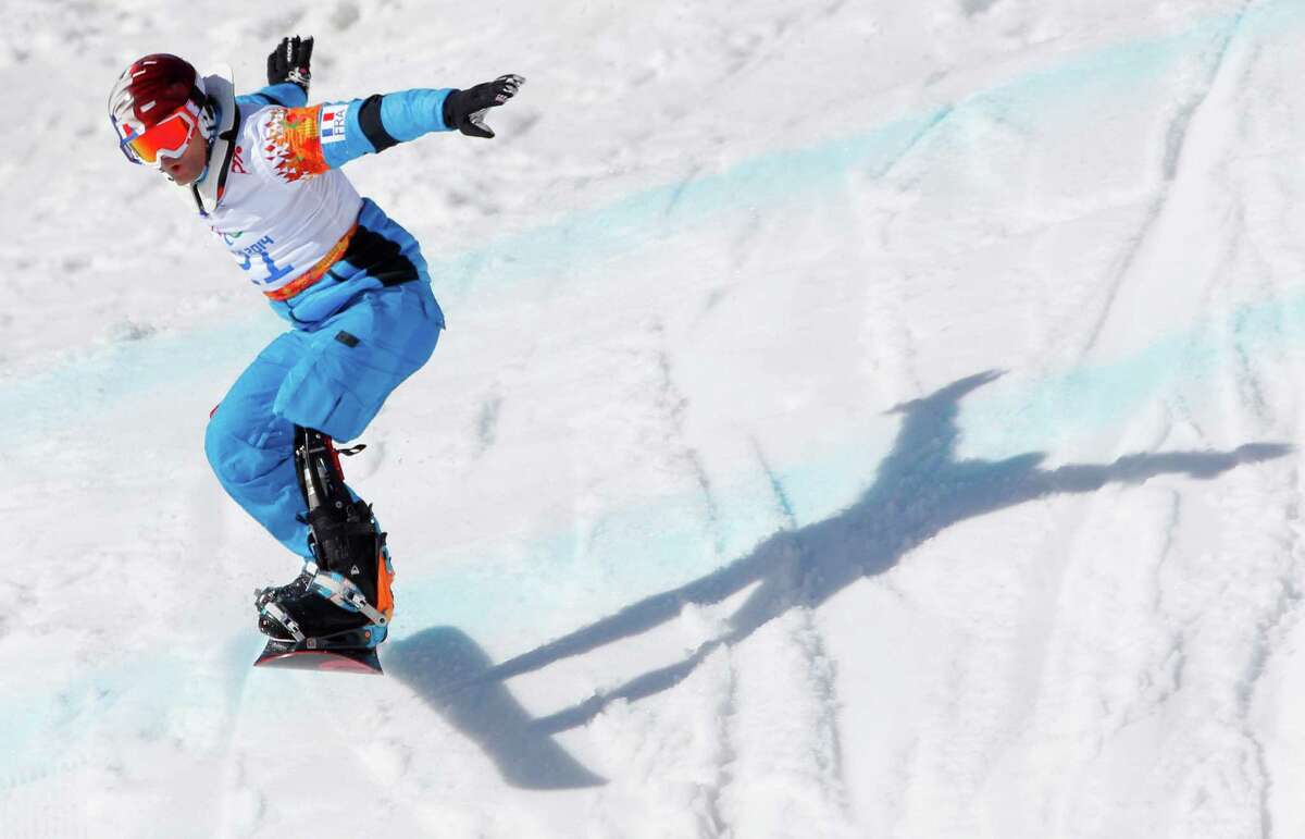 Patrice Barattero of France competes during men's para snowboard cross, standing event at the 2014 Winter Paralympic, Friday, March 14, 2014, in Krasnaya Polyana, Russia.