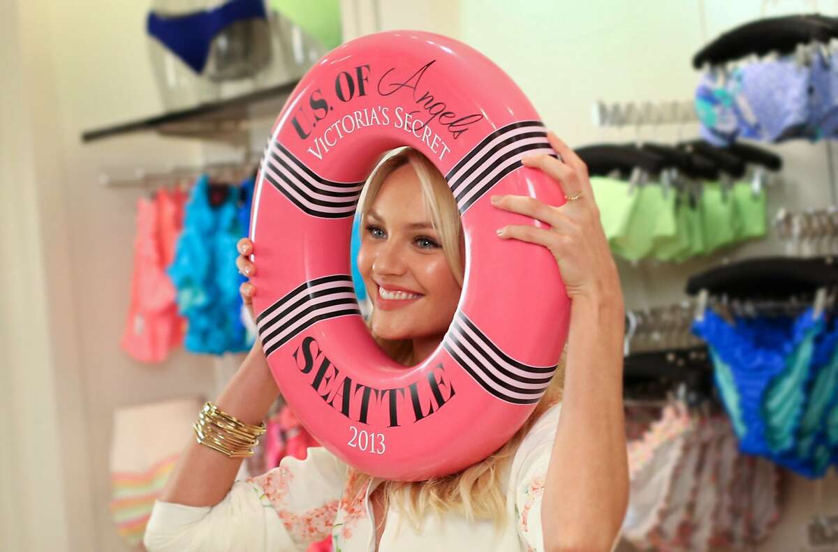 Supermodel Candice Swanepoel poses for photographers on Wednesday, July 10, 2013 in the Victoria's Secret store at Bellevue Square Mall. The Victoria's Secret model came to the local store after fans voted for three cities for the models to visit. The other winning cities in the promotion were Orlando and Milwaukee.