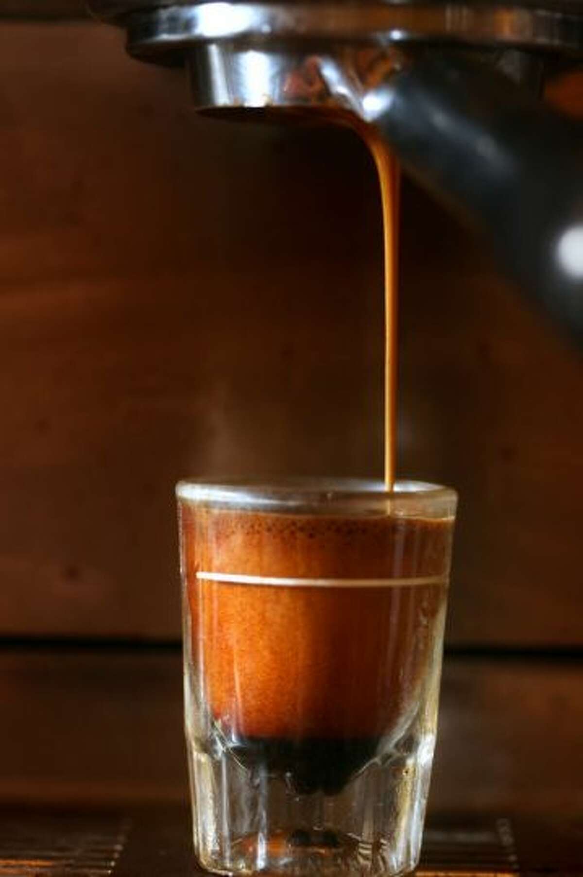 9. New York City, N.Y. - Coffee purist shop, Joe the Art of Coffee (pictured), is one reason why NYC made it into Travel + Leisure's top 10 list of best coffee cities. (Photo, of espresso at Joe The Art of Coffee, by Boston Globe, via Getty Images).