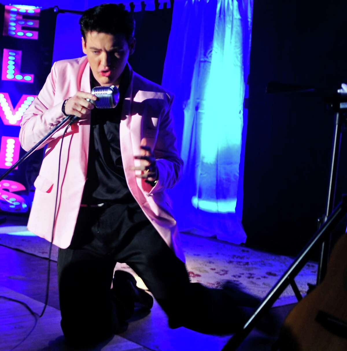 Nederland resident Jake Rowley, 18, performed his first live show as the American music giant - Elvis Presley - on Friday night at the County Seat Music Hall in Kountze. Photo by Cassie Smith/@smithcassie. March 14, 2014.