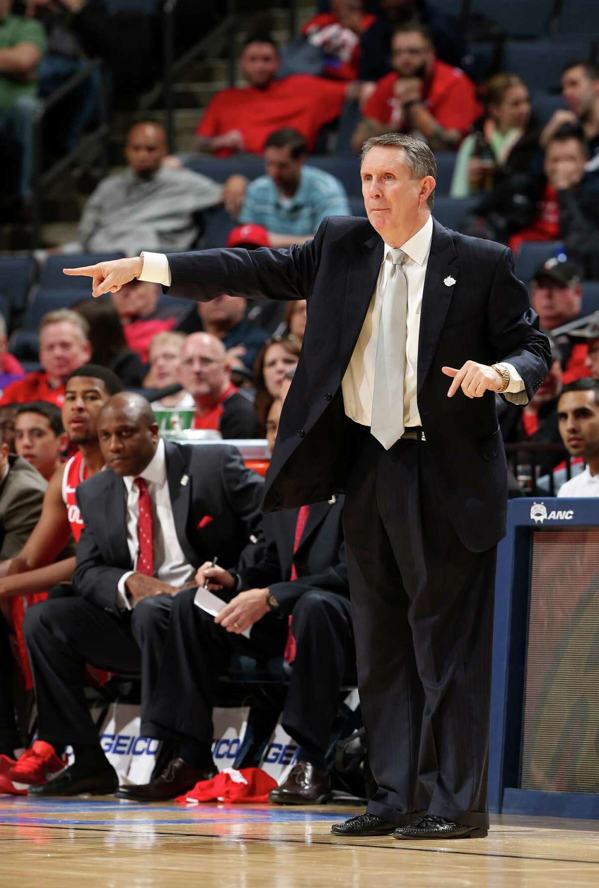 MEMPHIS, TN - MARCH 14: Head coach James Dickey of the Houston Cougars directs his team from the sideline against the Louisville Cardinals during the semifinals of the American Athletic Conference Tournament at FedExForum on March 14, 2014 in Memphis, Tennessee. Louisville defeated Houston 94-65.