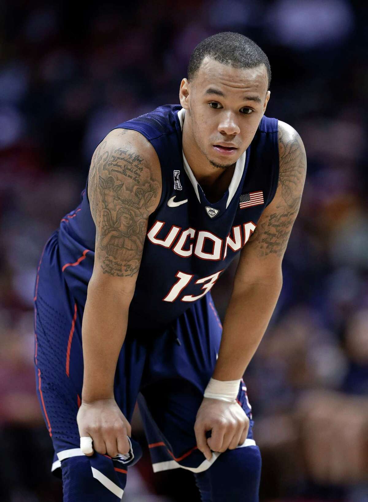 Connecticut guard Shabazz Napier waits for a player to shoot a free throw.