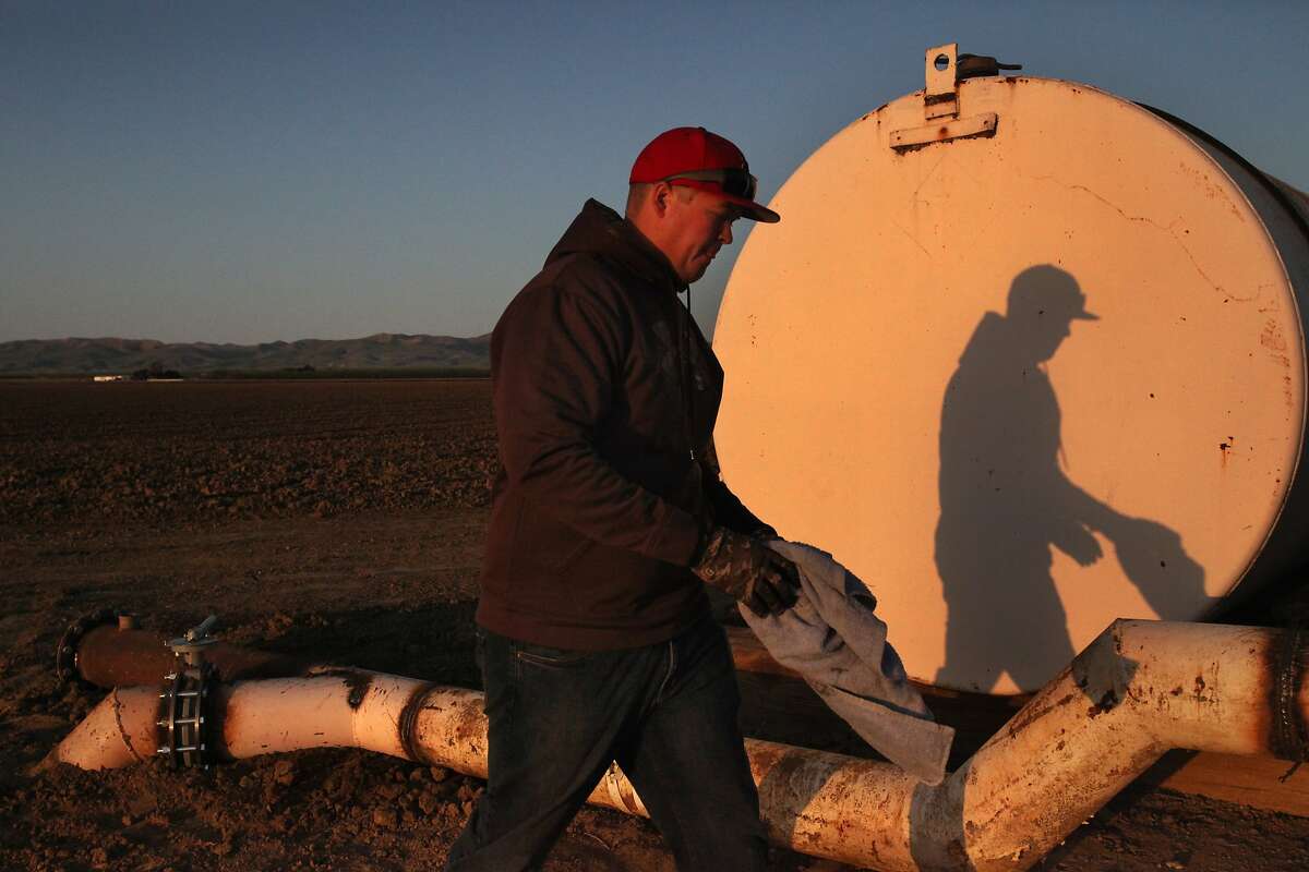 Brian Hicks, 29, checks the water level at one of a few existing wells on his family's land March 15, 2014 at the Hammonds Ranch, Inc. in Firebaugh, Calif. The family have not had to use the wells in years. Now that they will be using them, instead of checking the levels once a month, Hicks will be checking them once every other week. The Hammonds Ranch is allowing over 4,000 acres of approximately 5,000 acres of farm land to fallow this year because of the drought. This year they will be keeping their grapes and some pistachios alive using well water they haven't had to tap in years and some supplemental water. Hicks, who lives on the ranch with his wife and young daughter, is a 4th generation Hammonds rancher. He is currently back in school to get his certification in special studies of enology, so he can get into wine making. Hicks says he's wanted to be part of the family business since he was a child. Despite the uncertainty that the drought brings, he's still pursuing his dream, "I believe in it, it's something that everybody needs," he said. "Food is a necessity of life."