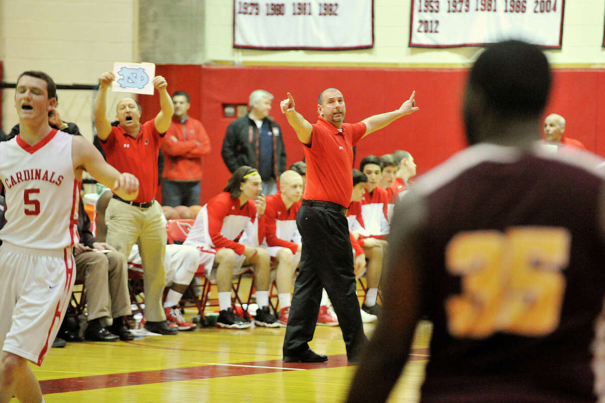 Greenwich head coach Bill Brehm gives directions to his team during their Class LL boys basketball quarterfinal game against New Britain at Greenwich High School in Greenwich, Conn., on Monday, March 17, 2014. Greenwich won, 59-54.
