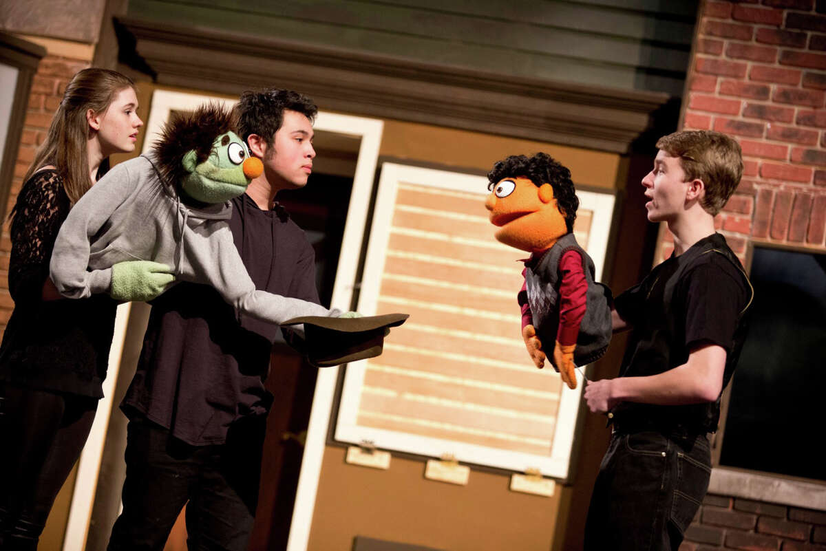 From left, Rachel Corbally, Joe Badion and Jack Baylis rehearse a scene from the Staples Players' production of "Avenue Q." Performances of the Sesame Street spoof about life after college are scheduled at Staples High School March 21, 22 and 23.