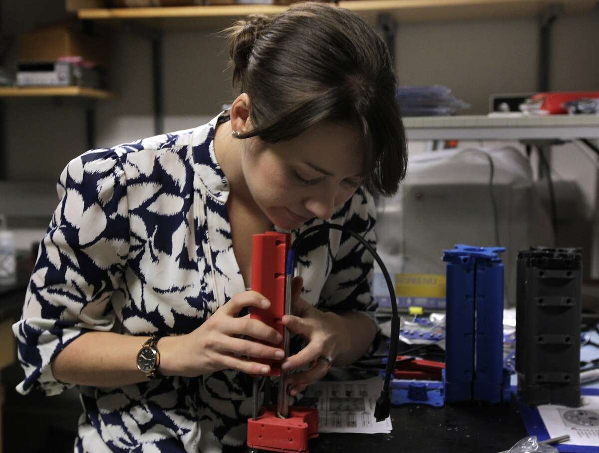 Paige Ottoson assembles a plastic mold for a smart diaphragm device in San Francisco, Calif. on Friday, March 14, 2014. A team of engineers at the UCSF Mission Bay campus is developing a wireless device that they hope will detect early signs of pre-term births in pregnant women.