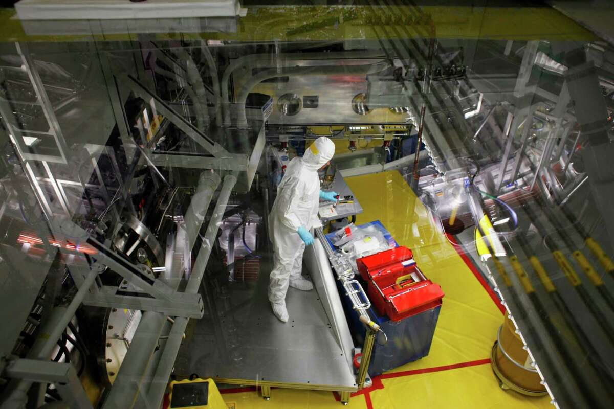 Technicians prepare a target at the National Ignition Facility at Lawrence Livermore National Laboratory on March 14, 2014 in Livermore, Calif.