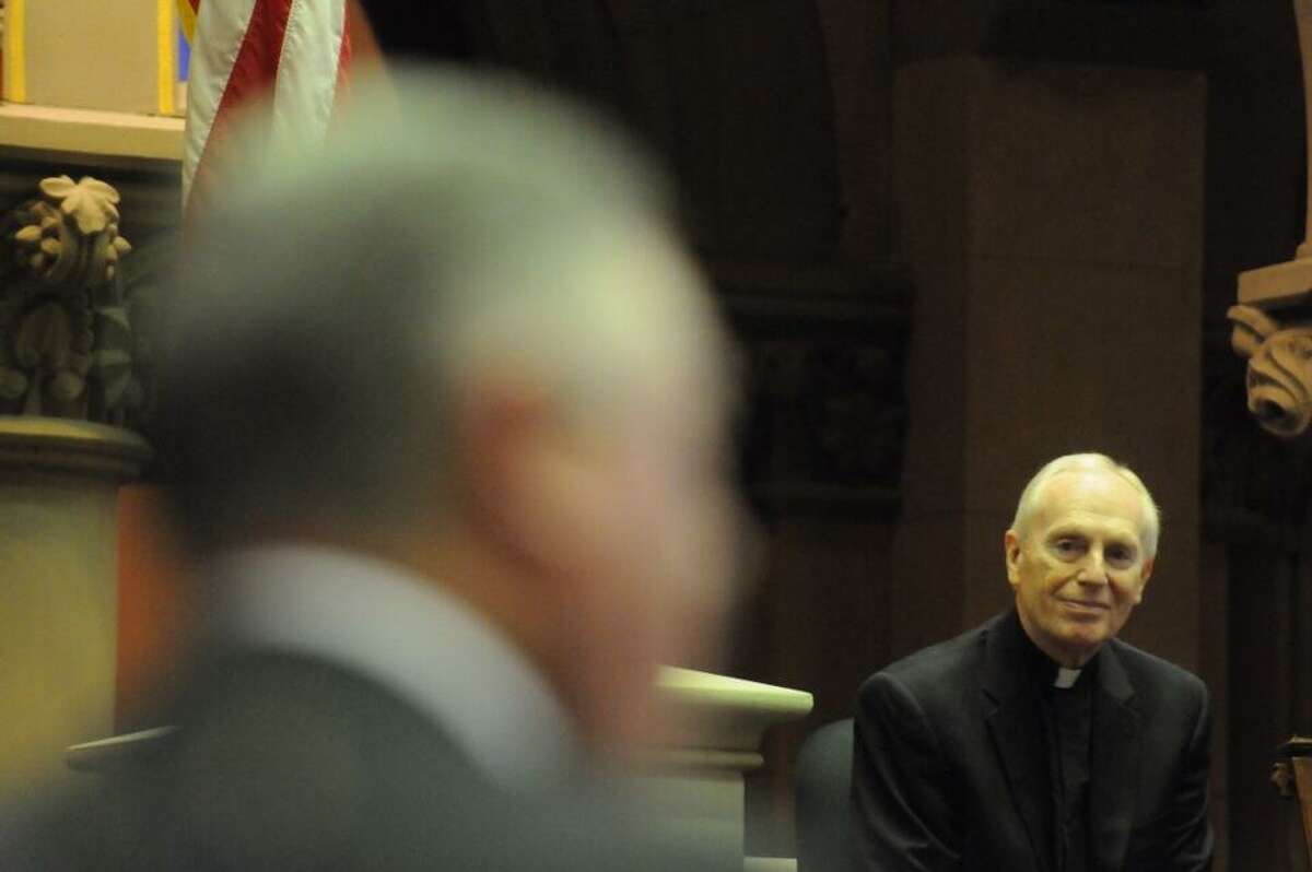 Assembly Member John McDonald introduces Bishop Howard Hubbard at the state Assembly. (Michael P. Farrell/Times Union)