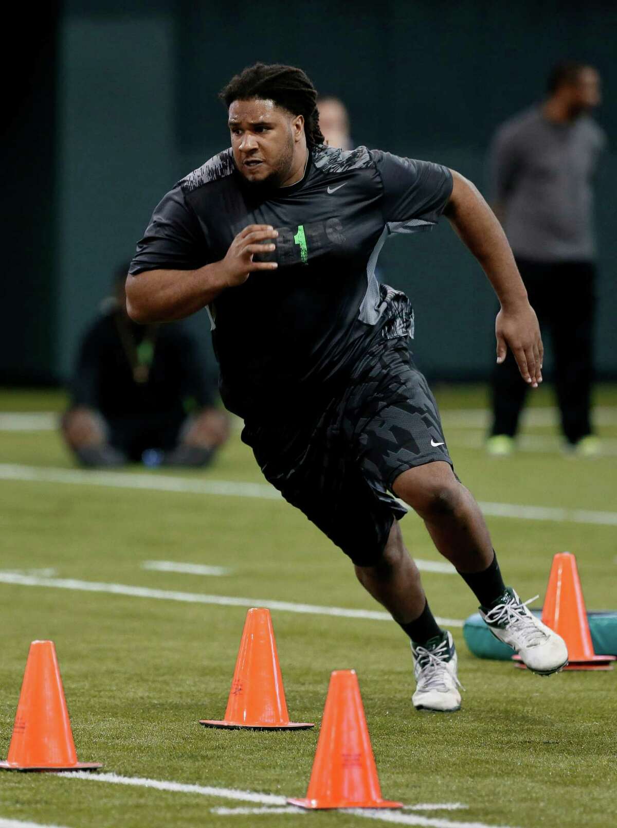 Offensive lineman Cyril Richardson, one of 18 players taking part in Baylor's pro day, runs the cone drill Wednesday.