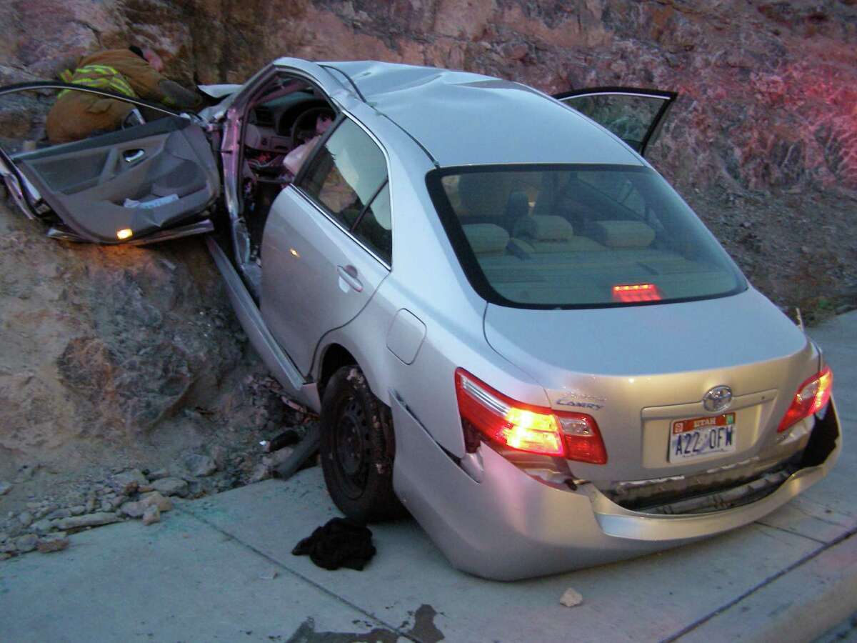 FILE - In this Nov. 5, 2010 file photo released by the Utah Highway Patrol, a Toyota Camry is shown after it crashed as it exited Interstate 80 in Wendover, Utah. Police suspect problems with the Camry's accelerator or floor mat caused the crash that left two people dead and two others injured. The Wall Street Journal is reporting Wednesday March 19, 2014 the U.S. Justice Department may reach a $ 1 billion settlement with Toyota Motor Corp., ending a four-year criminal investigation into the Japanese automaker's disclosure of safety problems. (AP Photo/Utah Highway Patrol, File)