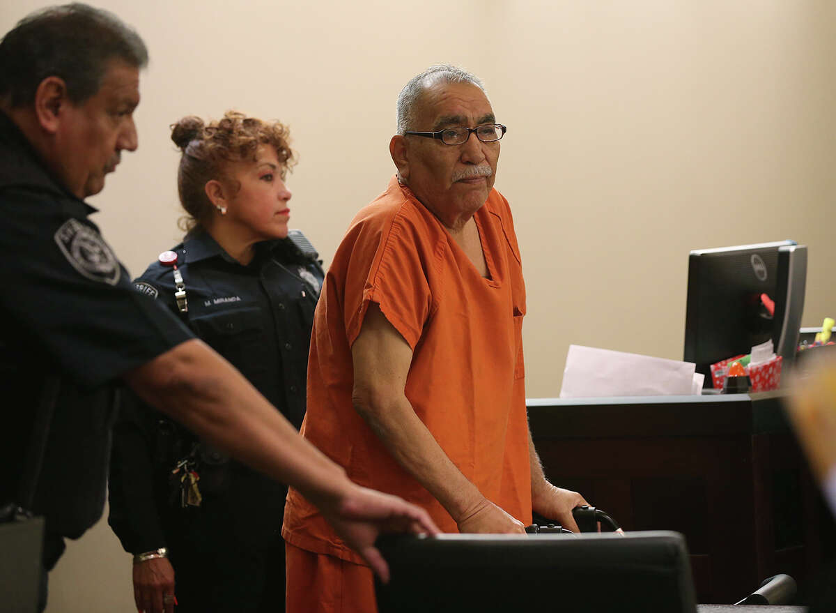 Benito Cavazos Valverde, 64, is escorted into the Bexar County 290th District Court for his sentencing hearing, Thursday, March 20, 2014. In February, Valverde was convicted of murdering David Deleon Ramirez, 61, during a bar shooting in 2011. Judge Melisa Skinner sentenced Valverde to 30 years in prison.