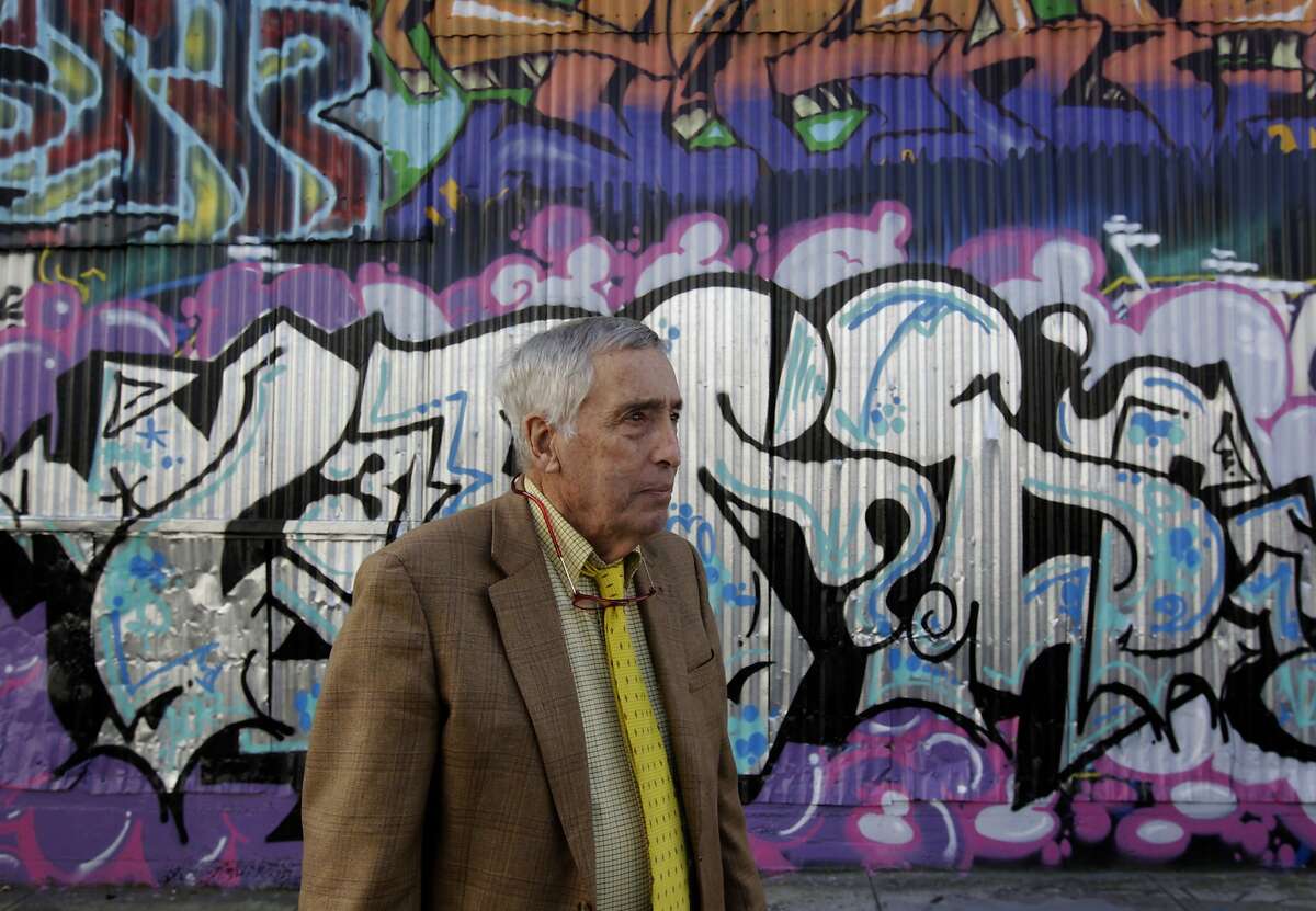 Property owner Larry Mathews views the work of taggers and graffiti artists defacing buildings on Erie Alley in San Francisco, Calif. on Thursday, March 20, 2014. Mathews says he spends $15,000 annually to cover graffiti on his building and is not happy with the city's current graffiti eradication policy.
