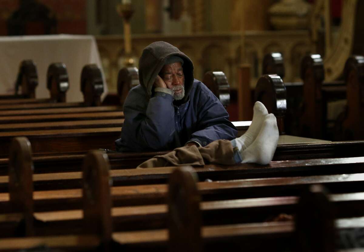 Norval Hendricks Sr. rested in the pews of St. Boniface Monday March 17, 2014. The Gubbio project at St. Boniface Catholic church in San Francisco, Calif is celebrating its ten year anniversary helping homeless find some sleep and peace from street life.