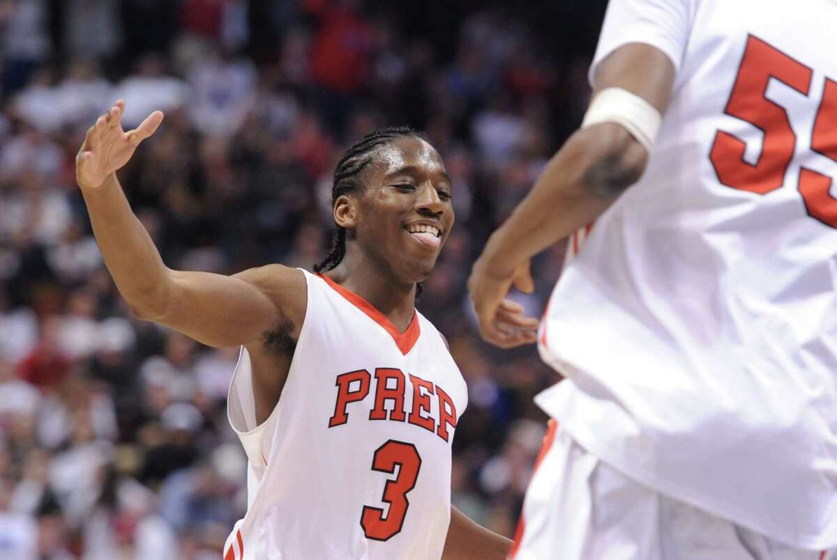 Fairfield Prep's Keith Pettway (3) celebrates in the CIAC Class LL high school boys basketball state championship game between No. 1 Fairfield Prep. and No. 2 Bridgeport Central at Mohegan Sun Arena in Uncasville, Conn. on Saturday, March 22, 2014.
