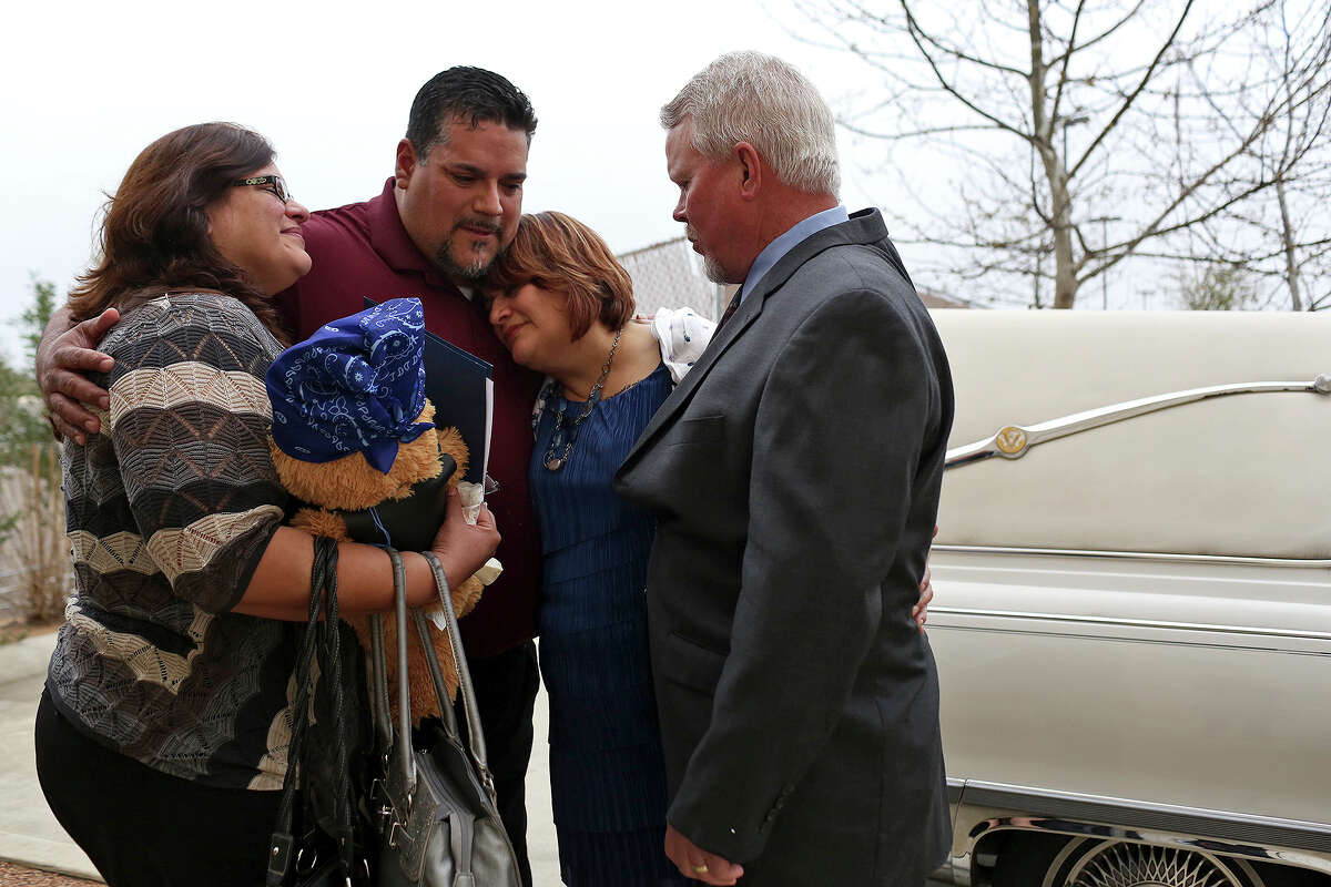 Pamela Allen, center, grieves with her family including her husband, Tim Allen, right, her sister, Yvette Montejano, left, and their brother, Samuel Espurvoa, after she and Tim carried Baby Noel's casket to the hearse after the baby's funeral at Summit Christian Center in San Antonio on Thursday, March 22, 1014. Pamela worked for months to make sure Baby Noel had a proper funeral and burial.