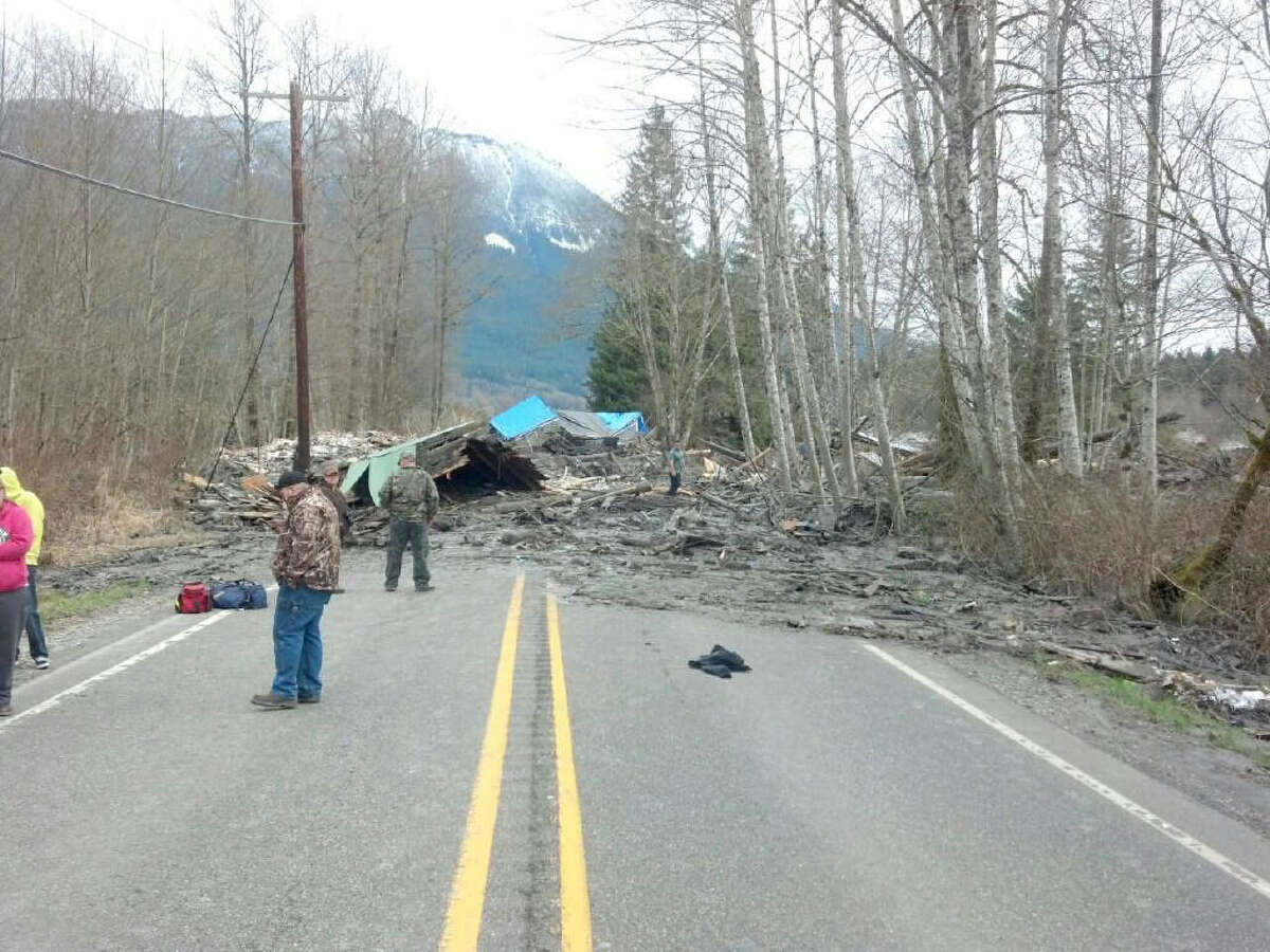 A massive landslide of mud in rural Washington state proved deadly, killing at least three people, and damaged homes and made impassible roads like this one.