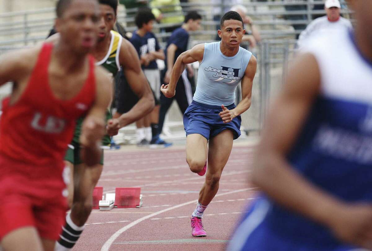 Johnson's Robert Ford (center), who holds the city record in the 800 meters, dashes to his personal-best time of 48.39 in the 400 at the Alamo Relays.