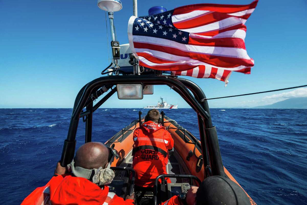 The crew of a Coast Guard speedboat heads back to the 210-foot cutter Dauntless off of northern Haiti during a law enforcement patrol. The Dauntless is based in Galveston.