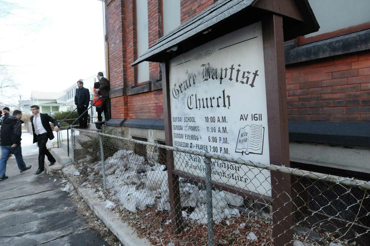 People arrive for service at Grace Baptist Church on Sunday, March 23, 2014, in Troy, N.Y. A drawing was held after service and a modified AR-15 rifle was given away. (Paul Buckowski / Times Union)