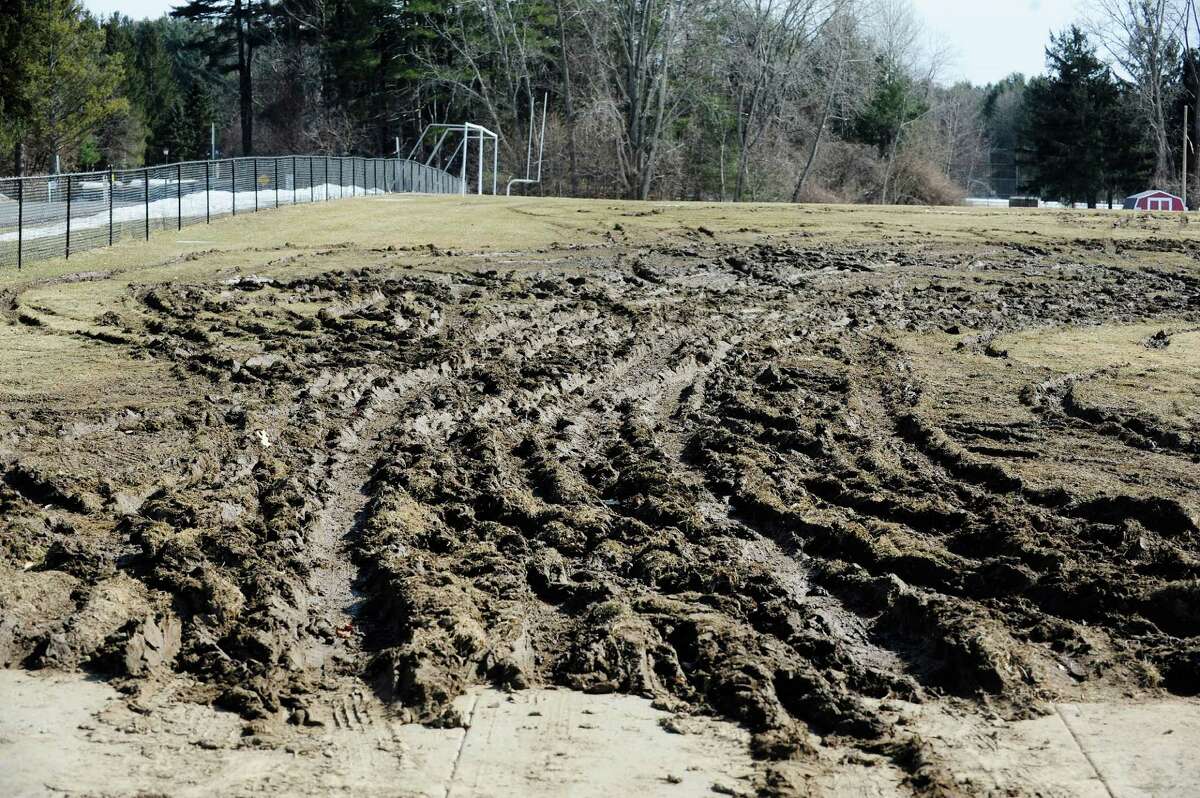 Athletic fields at Farnsworth Middle School show damage on Sunday, March 23, 2014 at the school in Guilderland, NY. People showing up to take a state civil service exam on Saturday parked on the grass, destroying the fields. (Paul Buckowski / Times Union)
