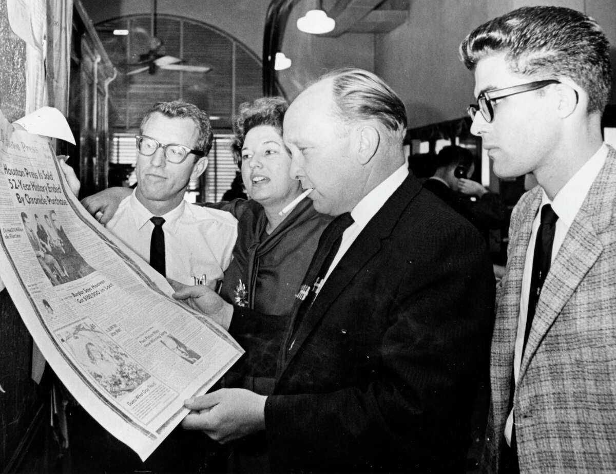 Houston Press writers, photographers read paper's swan song: From left, Arlo Wagner, Marge Crumbaker, Bill Cooksey, Frank Grizzaffi, March 20, 1964. After the Press closed, Crumbaker would embark on a long career with the Houston Post.
