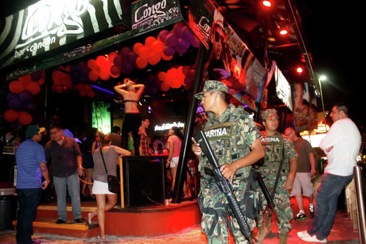 First up: Spring break was off to a crowded start in Cancun. In this photo, Mexican navy marines patrol the nightclub section as Spring Break revelers enjoy in the resort city of Cancun, Mexico, Feb. 26. Cancun is one of the No. 1 foreign destination for U.S. college students wanting to enjoy Spring Break. (AP Photo/Israel Leal)