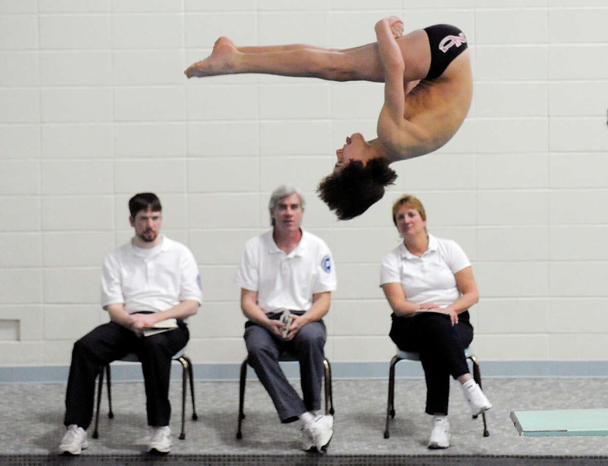 Bobby Ross of New Canaan High School competes in the FCIAC diving championships at Westhill High School in Stamford, Friday, Match 2, 2012.