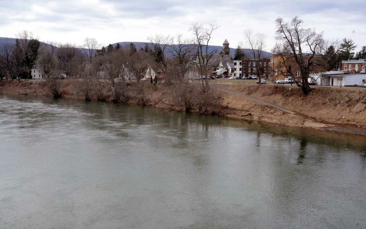 The west branch of the Susquehanna River flows past Jersey Shore, Pa. on Sunday March 23, 2014. About a third of the borough (population 4,300) is in a flood hazard zone and nearly 470 homes in town are expected to see flood insurance premium hikes because of changes to the National Flood Insurance Program. (AP Photo/Ralph Wilson) ORG XMIT: PARW501