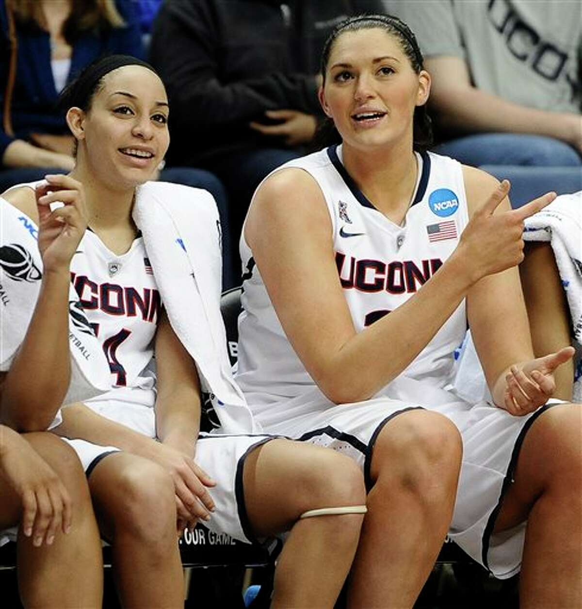 Connecticut seniors Bria Hartley and Stefanie Dolson watch the last few minutes of the second half of a second-round game of the NCAA women's college basketball tournament, Tuesday, March 25, 2014, in Storrs, Conn. Connecticut won 91-52. (AP Photo/Jessica Hill)