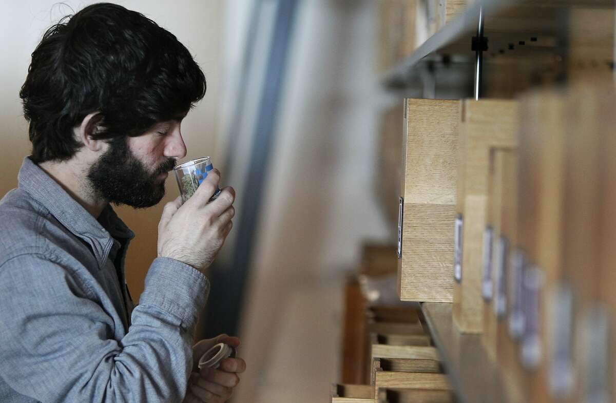 Member consultant Alex Silverman takes a quick whiff of a medical marijuana product as he searches for the right one for a patient member March 26, 2014 at the non-profit SPARC dispensary building in San Francisco, Calif. SPARC provides affordable medical marijuana to its members as well as education on other alternative health options for medical supplements.