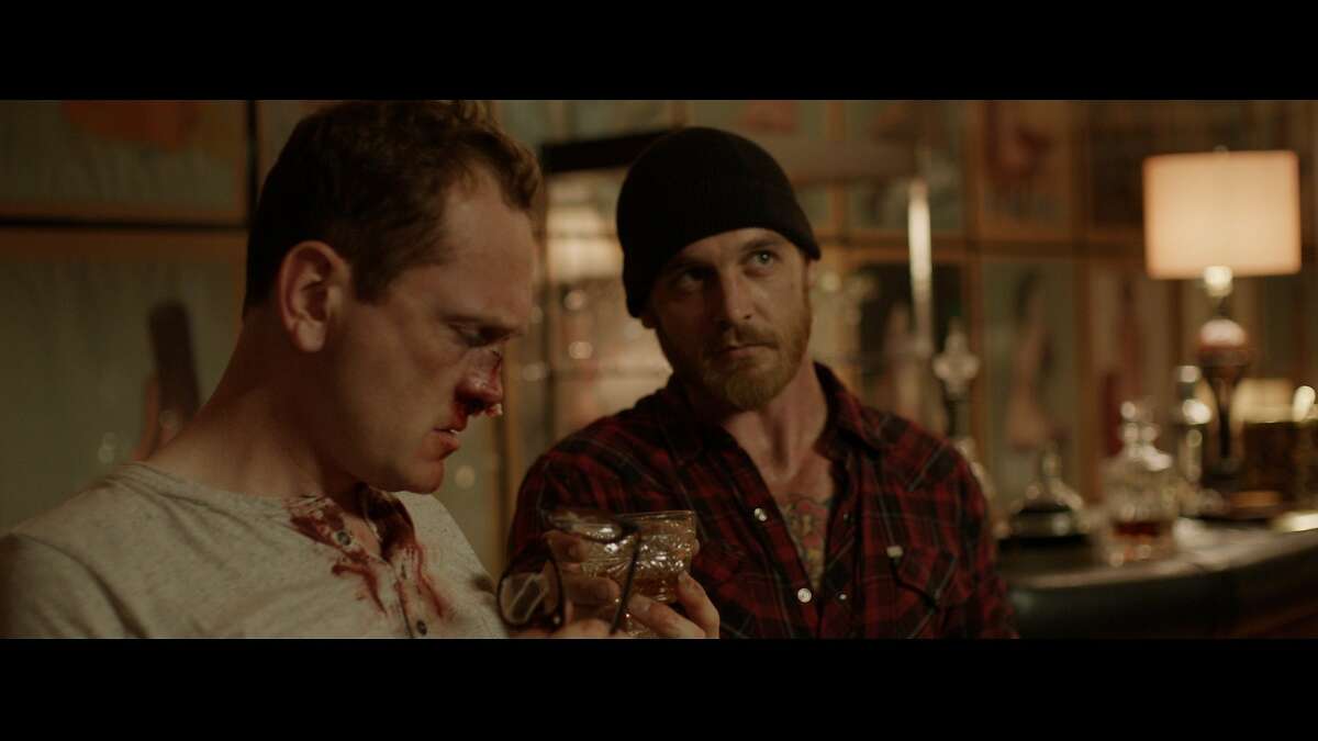 Craig (Pat Healy) and Vince (Ethan Embry) in over their heads in Drafthouse Films?• Cheap Thrills.