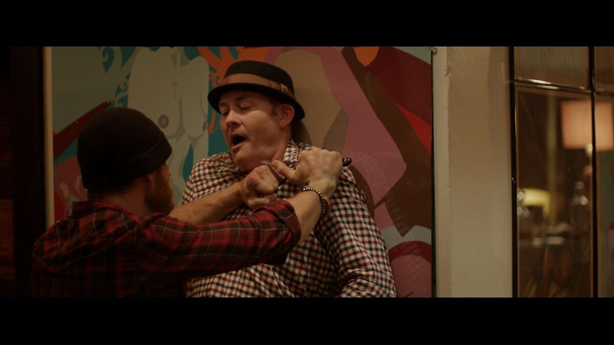 Vince (Ethan Embry) and Colin (David Koechner) in a heated moment in Drafthouse Films?• Cheap Thrills.
