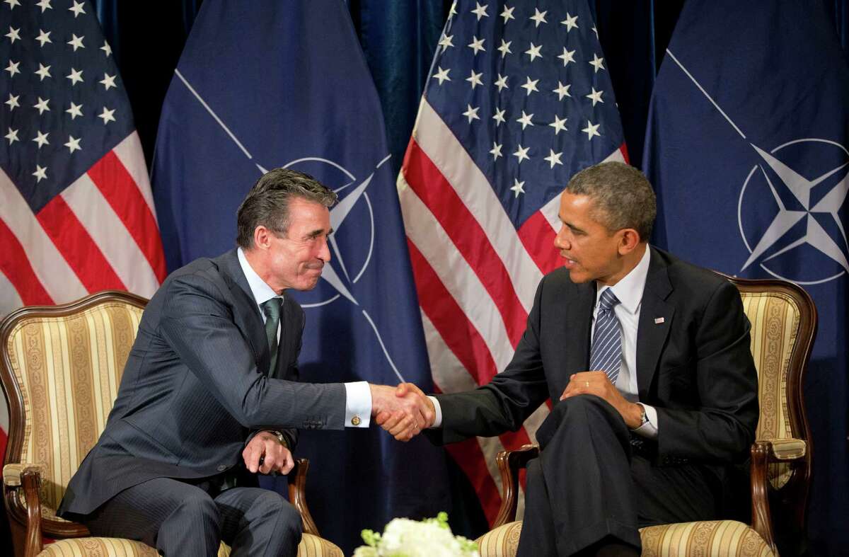 President Barack Obama meets with NATO Secretary General Anders Fogh Rasmussen in Brussels, Belgium, Wednesday, March 26, 2014. Obama is on a one day trip to Belgium to shore up commitments he received from allies in The Hague, Netherlands, to reassure Eastern Europeans members of NATO that the alliance will stand by them and to make a larger point about European security a quarter-century after the fall of the Iron Curtain. (AP Photo/Pablo Martinez Monsivais) (AP Photo/Pablo Martinez Monsivais)