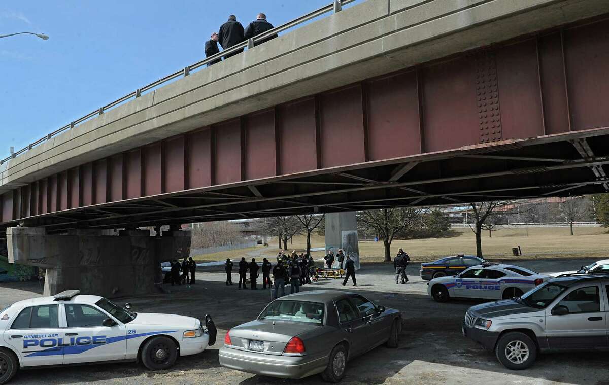 Car hits bridge; suspect jumps