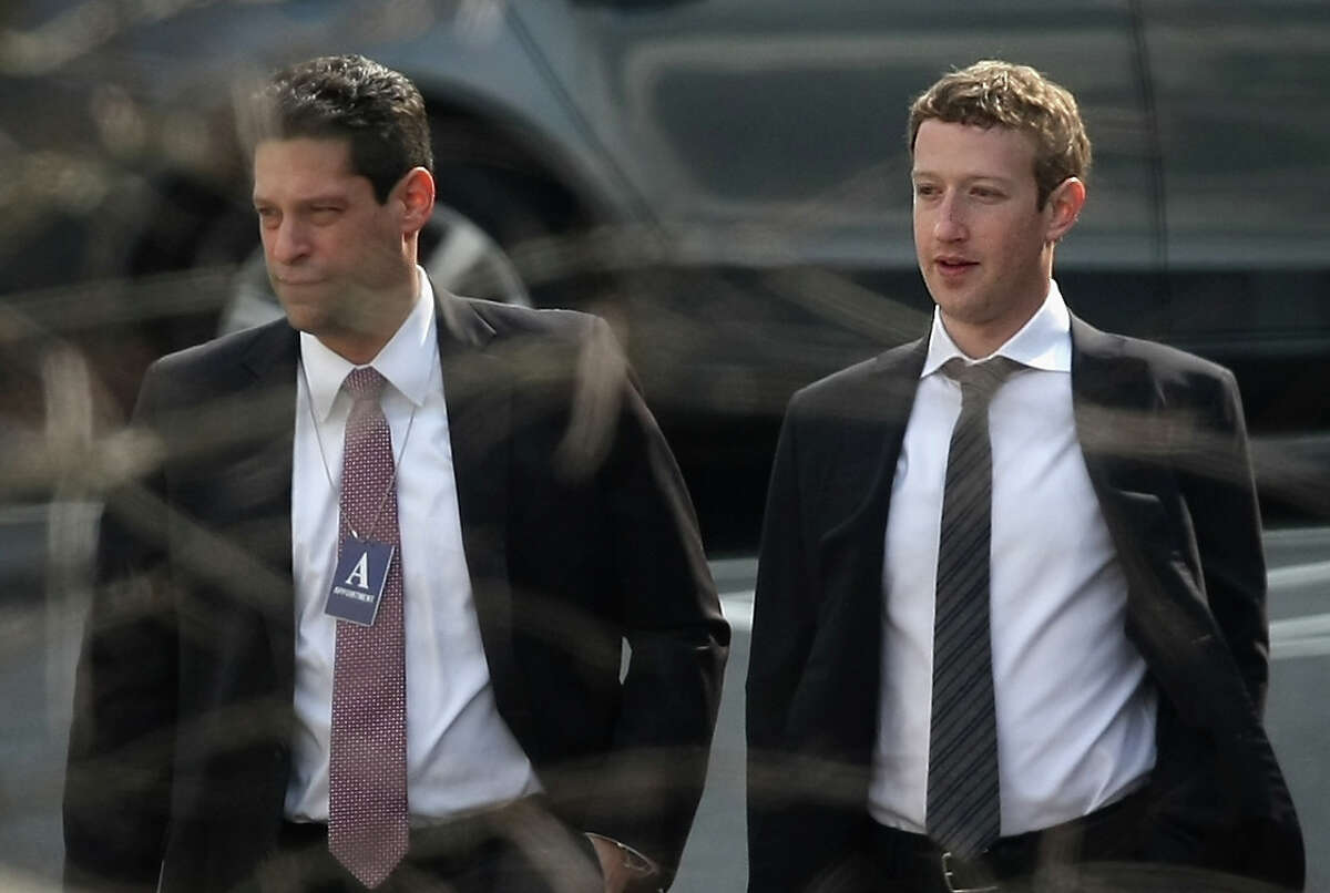 Facebook's Mark Zuckerberg, right, arrives at the White House last week. On Tuesday he called the Oculus deal "a long-term bet on the future of computing."