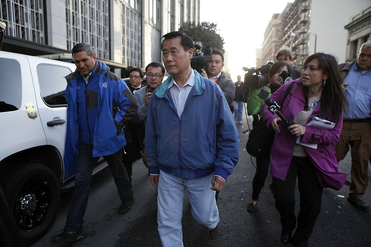 Senator Leland Yee is chased by reporters as he leaves the federal building in San Francisco, CA, Wednesday Mar. 26, 2014.