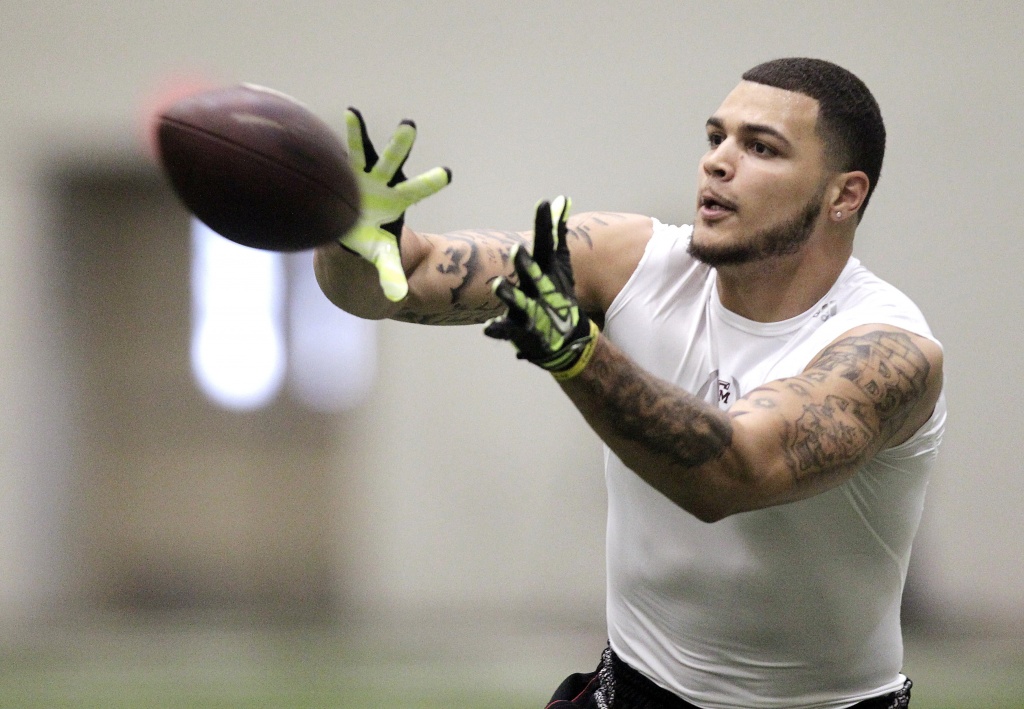 Former Texas A&M receiver Mike Evans sits during national anthem to protest  Donald Trump's win