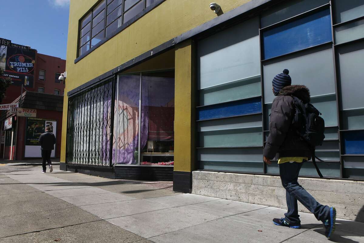 A pedestrian walks past the front of the non-profit SPARC dispensary building March 26, 2014 in San Francisco, Calif. SPARC provides affordable medical marijuana to its members as well as education on other alternative health options for medical supplements.