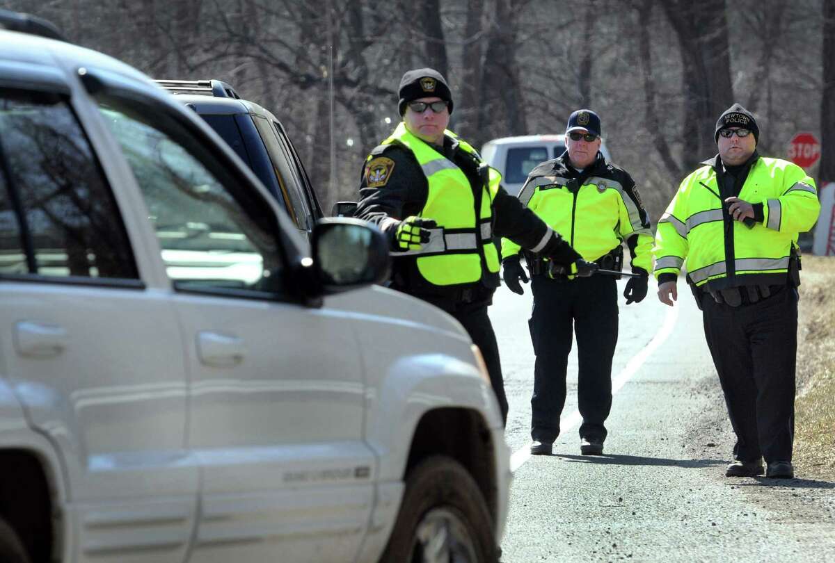 Police from area departments combined forces Thursday for the third wave of the "Phone in One Hand, Ticket in the Other" campaign. Police set up along Route 7 near the Ridgefield/ Redding border to stop drivers violating the cellphone law, Thursday, March 27, 2014.