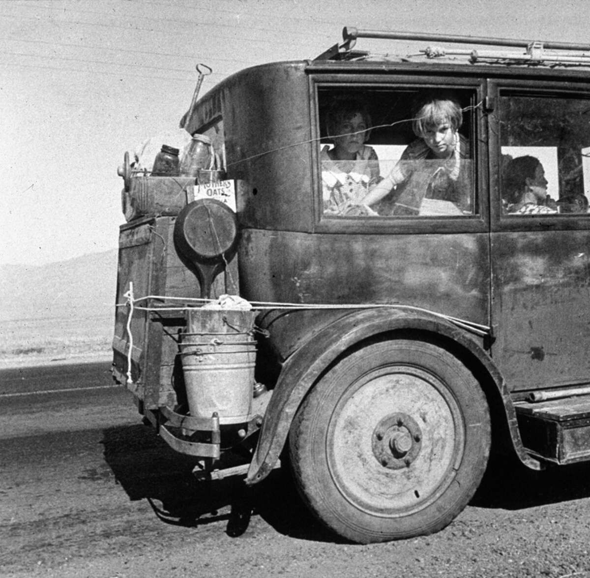 A family of drought refugees from Abilene, Texas, on the road in California, where they are trying to find work. (Photo by Dorothea Lange/Getty Images)