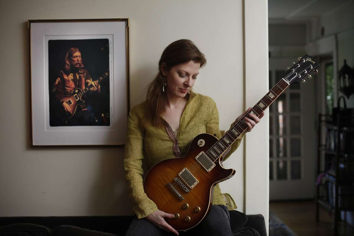 Galadrielle Allman, daughter of Duane Allman, founder of Allman Brothers who crashed his motorcycle and died when he was 24 and she was 2, poses for a photo in her home on Wednesday, March 19, 2014, in Berkeley, Calif. Allman has written a book about her dad called "Please Be With Me: A Song for my Father Duane Allman.