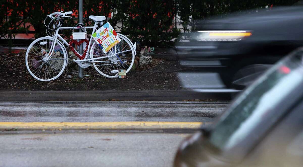 A ghost bike stands near the location where bike rider Chelsea Norman lost her life at Waugh and West Gray on Thursday, Jan. 23, 2014, in Houston. There have been 23 bike riders killed after being struck by a vehicle in the past 5 years. ( Mayra Beltran / Houston Chronicle )