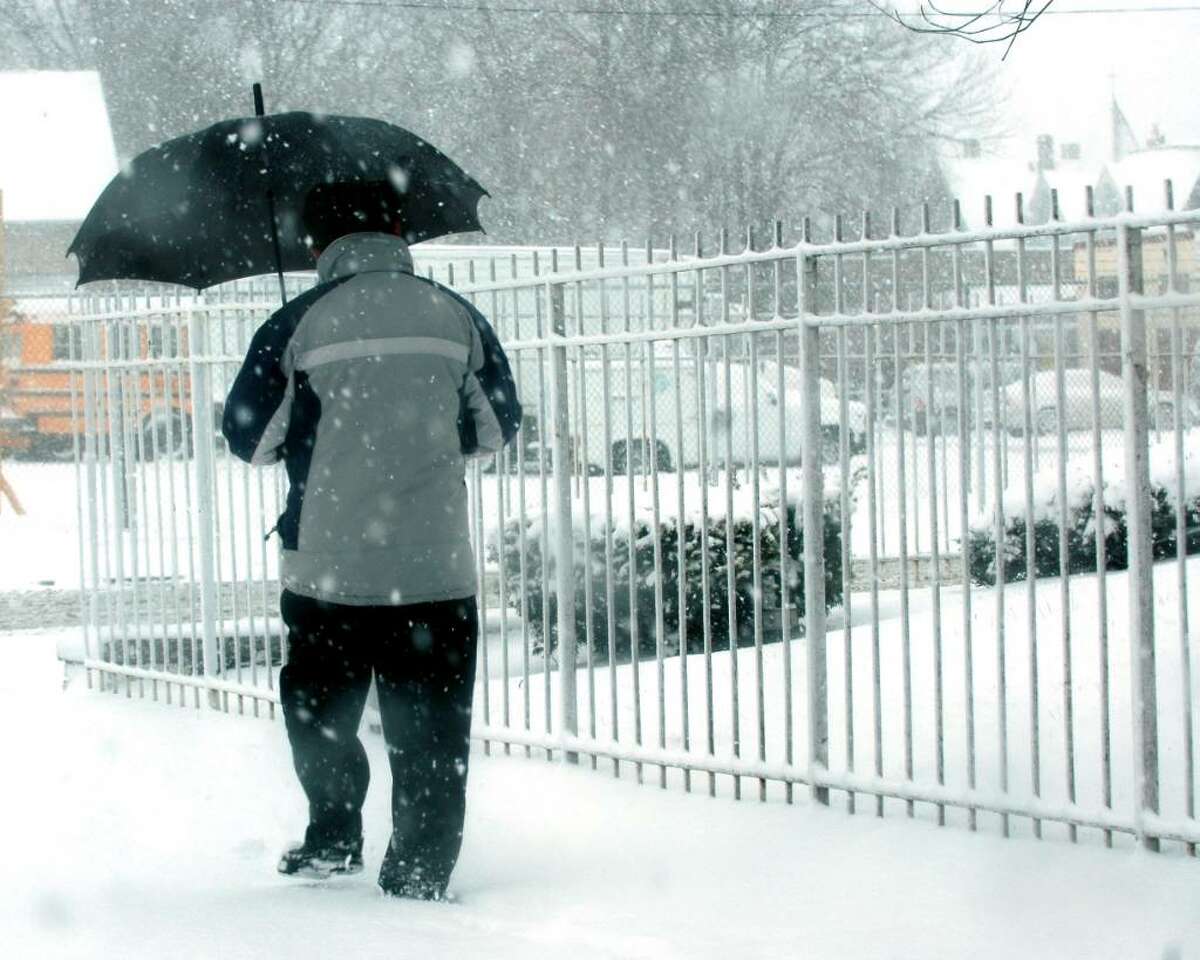 A pedestrain battles the snowstorm as he walks down Colorado Avenue in Bridgeport, Conn. on the morning of Feb. 10, 2010.