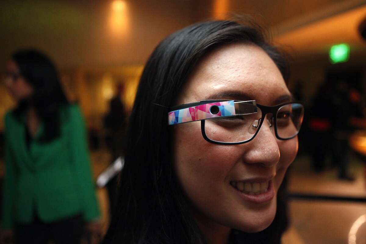 Libby Chang of Sunnyvale shows off her glasses with a decal from the company GPop on the side, during a Google Glass meet-up at the Stanford Court Hotel in San Francisco, CA, Friday March 28, 2014.