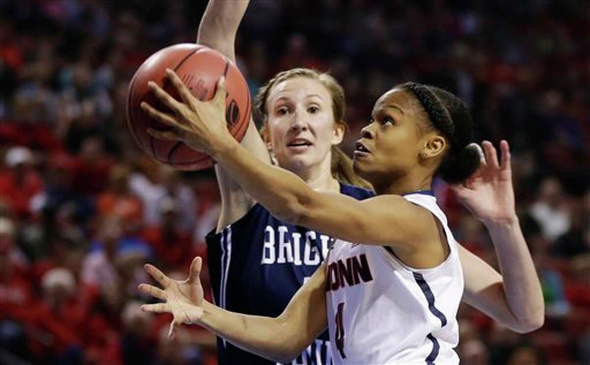 Connecticut's Moriah Jefferson (4) goes for a layup against BYU's Jennifer Hamson, rear, during the first half of a regional semifinal in the NCAA college basketball tournament in Lincoln, Neb., Saturday, March 29, 2014. (AP Photo/Nati Harnik)