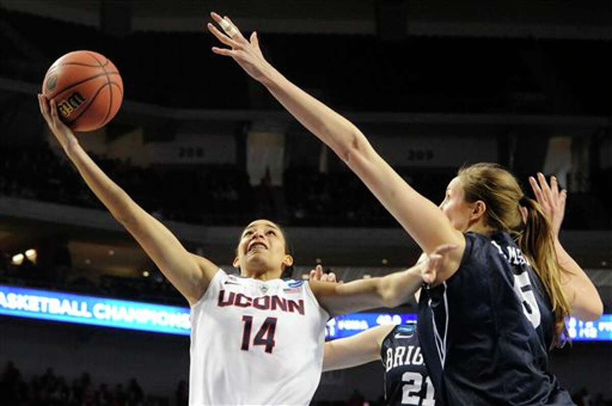 Connecticut's Bria Hartley (14) takes a shot against BYU's Jennifer Hamson (5) during the second half of a regional semifinal in the NCAA women's college basketball tournament Saturday, March 29, 2014, in Lincoln, Neb. Connecticut won 70-51. (AP Photo/Dave Weaver)
