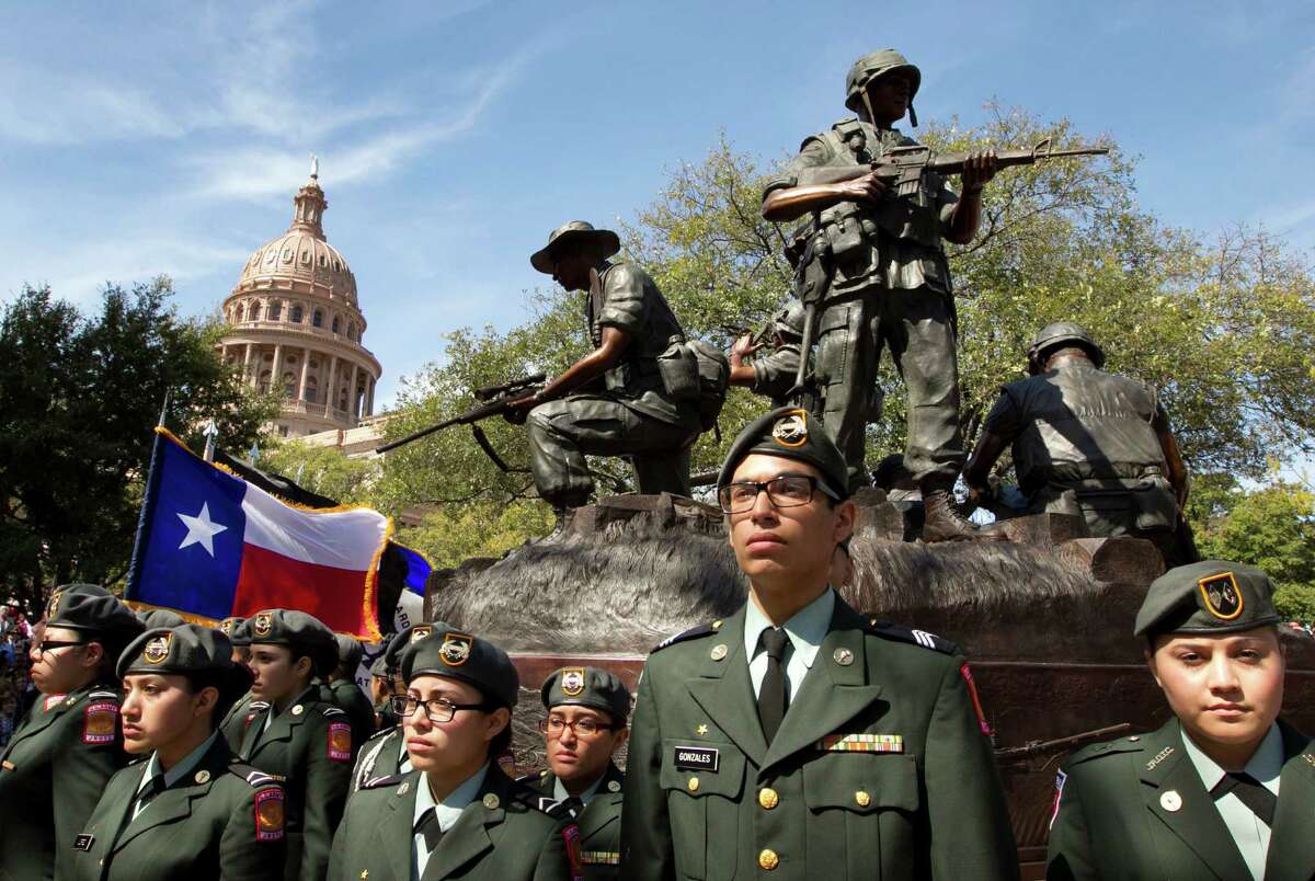 Members of the Memorial High School JROTC Minutemen Battalion from San Antonio participate in the dedication of the Texas state Capitol Vietnam Veterans Monument in Austin.